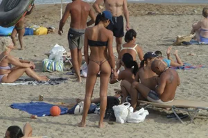 Topless girls on a beach in Barcelona