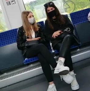 A couple of hot chicks in masks and tight pants sitting in a public bus creepshots