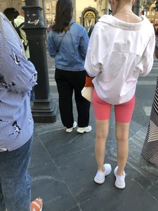 Awesome booty in spandex shorts, candid girl on a sidewalk