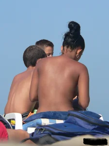 Hot ass topless beach girl with great tits lets her little brother oil up her ass in thong bikini