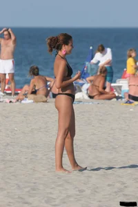 A bunch of sexy beach voyeur babes in bikinis, thongs and topless