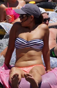 Sexy party girls in bikinis on a lake