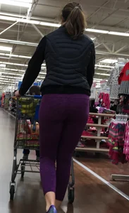 Milf shopping with a nice ass in purple leggings
