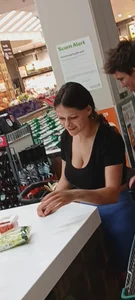 MILF w/ cleavage at checkout
