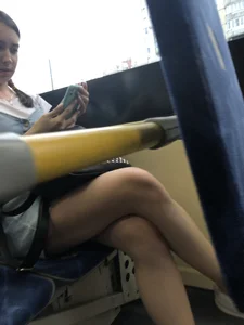 Girl in a Denim Dress and Sneakers with Nice Legs on the Bus Stop Candid Photo Gallery