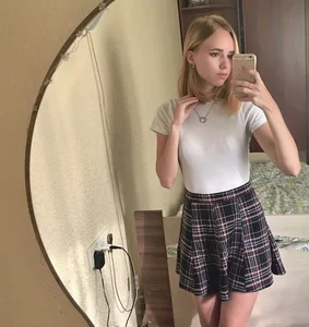 Cute Teen in a Skirt and Blouse Bedroom Mirror Selfie