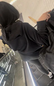 Tight curvy latina at airport pulls up pants