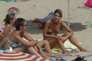 Topless girls on a beach in Barcelona