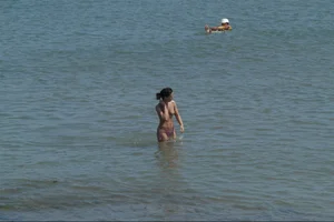 Girls on a nude beach in Sitges, Spain
