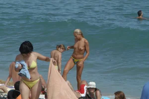 Topless girls on a beach in Barcelona