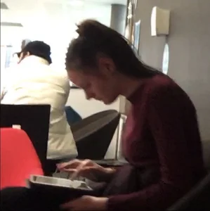 Young Skinny Girl Sitting With a Tablet