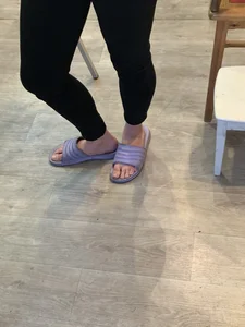 Teen Girl's Legs in Black Pants And Bare Feet in Slippers Home Creepshot