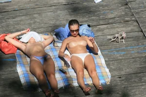 Two teens stripping and going topless to tan