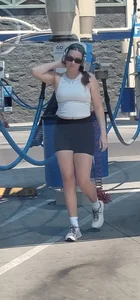 Yummy MILF @ carwash bent over in spandex shorts