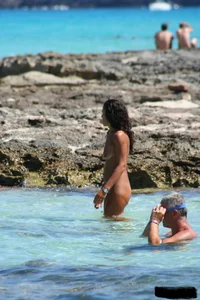 Nude beach ladies in the water showing their tits
