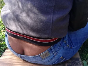 Ass crack seen from under pulled down jeans closeup creepshot