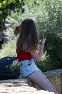 Pretty candid girls with nice legs sitting in denim shorts
