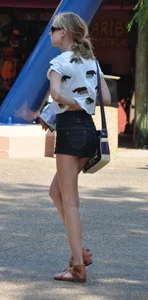 Skinny blonde chick in little denim shorts