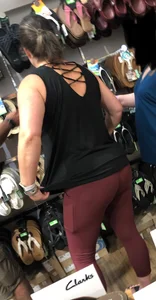 MILF in red leggings bends for the camera