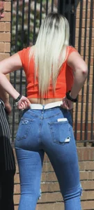Blonde in skintight jeans shopping with boyfriend