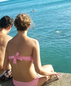 Sexy girl in red and white bikini on vacation