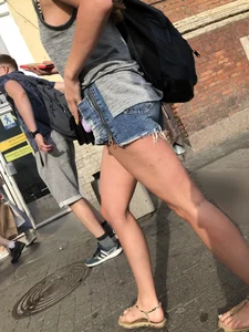 Girl in Denim Mini Shorts and Sandals With Sexy Legs And Feet Street and Subway Photos