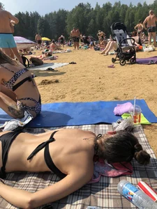Sexy Skinny Girl in Black Swimsuit Lying on a Beach Creepshots Archive