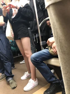 Girl in Shorts with Hot Skinny Legs in a Subway Train Candid