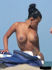 Hot ass topless beach girl with great tits lets her little brother oil up her ass in thong bikini