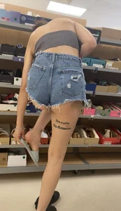 Slim Latina ass peeking out of shorts