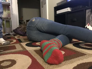 Skinny Girl in Blue Jeans And Socks Lying on the Floor - Flat Little Ass And Long Slim Legs