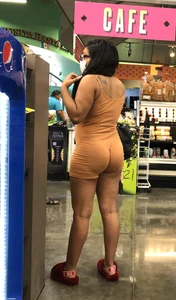 Latina with hard nipples and a big booty in tight spandex shorts outfit