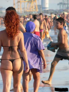 Bunch of sexy babes at the beach in thong bikinis