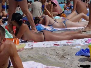 Beach voyeur girls in bikinis, thongs and topless