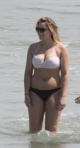 Big boobed thick blonde on the beach in a bikini