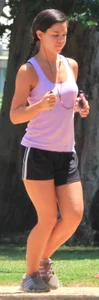 Hot brunette running in short shorts with vpl