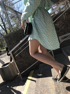 Girl in a Dress With Sexy Legs in Subway and on a Street