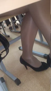 Crossed Legs of a Candid College Girl Under Desk Creepshot in a Classroom - Feet in High-Heeled Shoes
