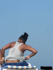 Hot ass topless beach girl with great tits lets her little brother oil up her ass in thong bikini