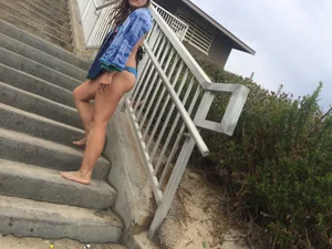 Blue thong beach babe walking up the stairs
