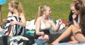 Teen taking off her dress in the park