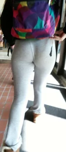 Cute college girl wearing grey leggings