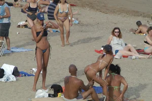 Topless girls on a beach in Barcelona