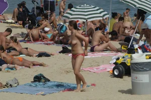 Topless girls on a beach in Barcelona