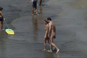 Girls on a nude beach in Sitges, Spain