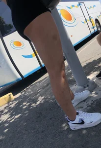 Girls with hot legs waiting at the bus stop