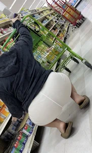 Visible Thong White Shorts in the supermarket