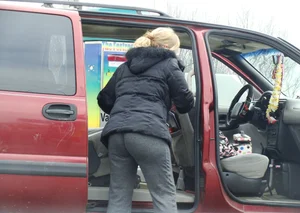Girls cleaning their cars in jeans and pants
