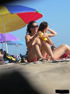 Sexy girls going topless at the beach showing off their sexy bodies