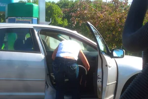 Girls cleaning their cars in jeans and pants